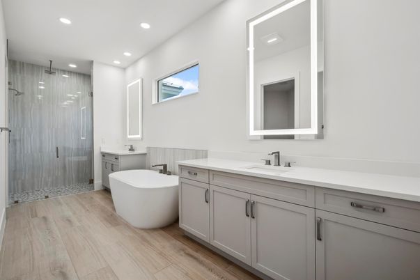 Bathroom, Dual Sink Vanities, Free Standing Baths, Glass Shower, Interior, Recessed Lighting, Wood Texture Flooring
