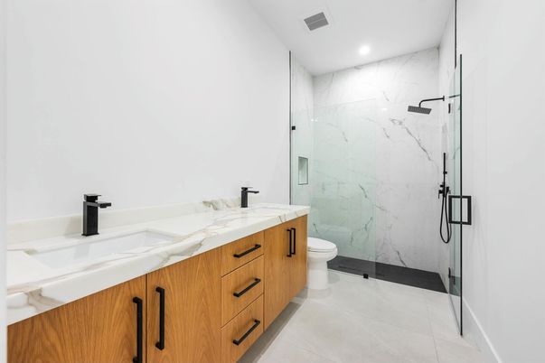 Bathroom, Dual Sink Vanities, Glass Shower, Interior, Marble Walls, Recessed Lighting