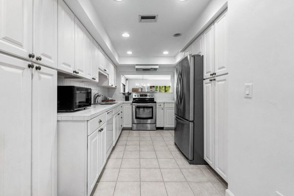 Interior, Kitchen, Recessed Lighting, Stainless Steel Appliances, Tile Countertops