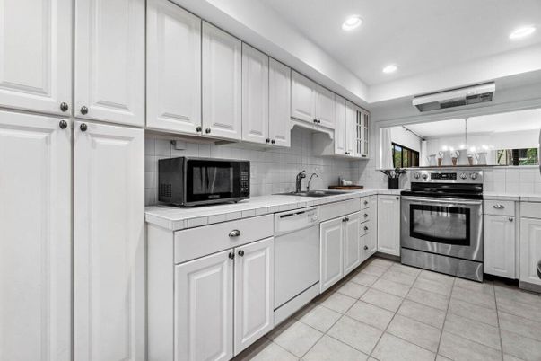 Chandelier, Interior, Kitchen, Recessed Lighting, Stainless Steel Appliances, Tile Countertops