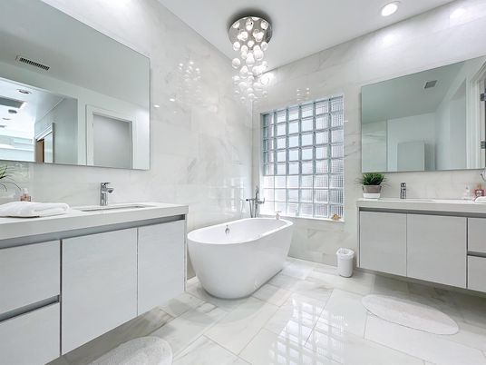 Bathroom, Dual Sink Vanities, Free Standing Baths, Interior, Marble, Marble Walls, Pendant Lights, Recessed Lighting