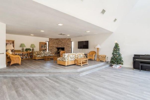 Fireplace, Interior, Living room, Piano, Recessed Lighting, Stone Walls, Wood Texture Flooring