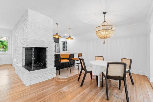 Dining room, Fireplace, Interior, Pendant Lights, Stone Walls, Wood Texture Flooring