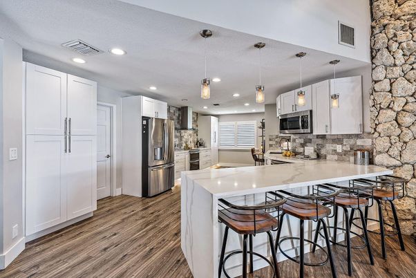 Interior, Kitchen, Pendant Lights, Recessed Lighting, Stainless Steel Appliances, Stone Walls, Wood Texture Flooring