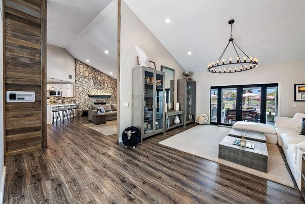 Chandelier, Dining room, Fireplace, Interior, Living room, Recessed Lighting, Stone Walls, Wood Texture Flooring