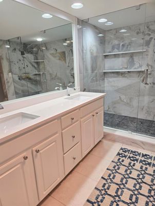 Bathroom, Dual Sink Vanities, Glass Shower, Interior, Marble Walls, Recessed Lighting