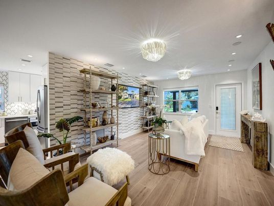 Chandelier, Interior, Kitchen, Living room, Recessed Lighting, Stainless Steel Appliances, Stone Walls, Wood Texture Flooring