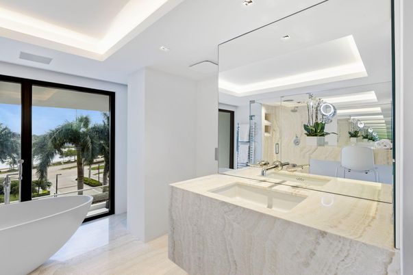 Bathroom, Dual Sink Vanities, Free Standing Baths, Glass Shower, Interior, Marble Walls, Recessed Lighting, Wood Texture Flooring