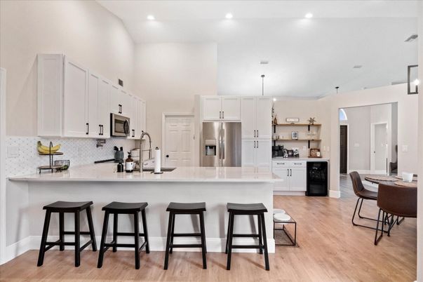 Dining room, Interior, Kitchen, Pendant Lights, Recessed Lighting, Stainless Steel Appliances, Wood Texture Flooring