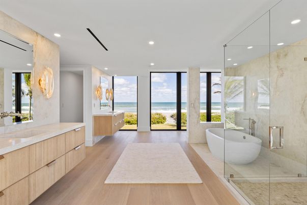 Bathroom, Free Standing Baths, Glass Shower, Interior, Marble Walls, Recessed Lighting, Water, Wood Texture Flooring