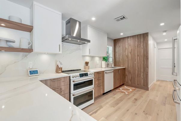 Interior, Kitchen, Marble Walls, Recessed Lighting, Stainless Steel Appliances, Wood Texture Flooring