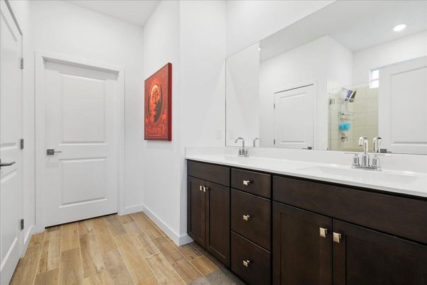 Bathroom, Dual Sink Vanities, Interior, Recessed Lighting, Wood Texture Flooring