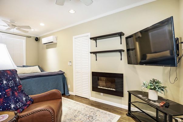 Bedroom, Fireplace, Interior, Recessed Lighting, Wood Texture Flooring