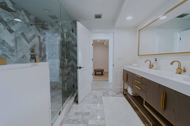 Bathroom, Dual Sink Vanities, Glass Shower, Interior, Marble, Marble Walls, Recessed Lighting