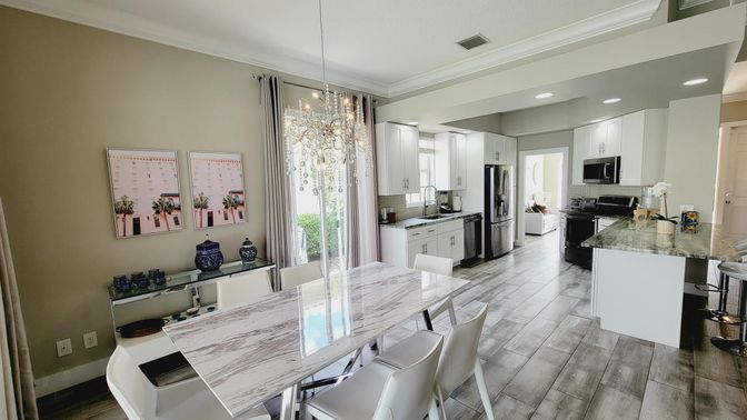 Dining room, Interior, Kitchen, Pendant Lights, Recessed Lighting, Stainless Steel Appliances, Wood Texture Flooring