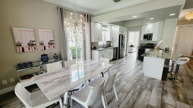 Dining room, Interior, Kitchen, Pendant Lights, Recessed Lighting, Stainless Steel Appliances, Wood Texture Flooring