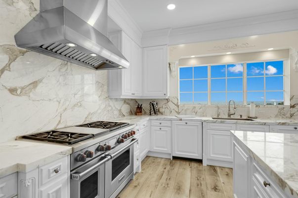 Interior, Kitchen, Marble Walls, Recessed Lighting, Stainless Steel Appliances, Wood Texture Flooring