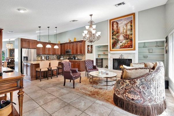 Chandelier, Dining room, Fireplace, Interior, Kitchen, Living room, Pendant Lights, Recessed Lighting, Stainless Steel Appliances