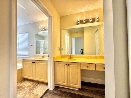 Bathroom, Chandelier, Dual Sink Vanities, Interior, Wood Texture Flooring