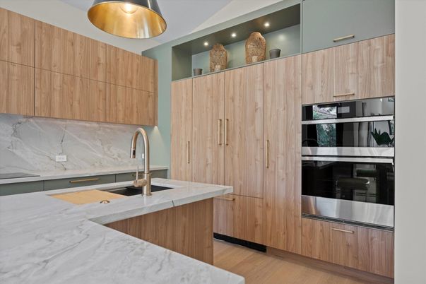 Interior, Kitchen, Marble Walls, Recessed Lighting, Stainless Steel Appliances, Wood Texture Flooring