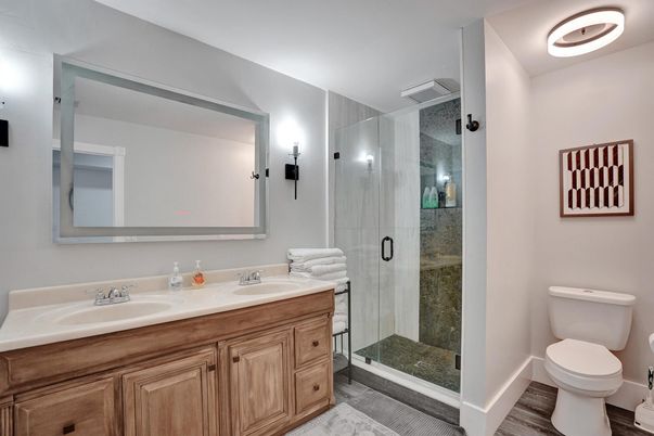 Bathroom, Dual Sink Vanities, Glass Shower, Interior, Wood Texture Flooring