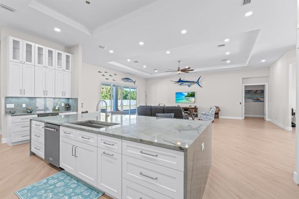 Dining room, Interior, Kitchen, Living room, Recessed Lighting, Stainless Steel Appliances, Wood Texture Flooring