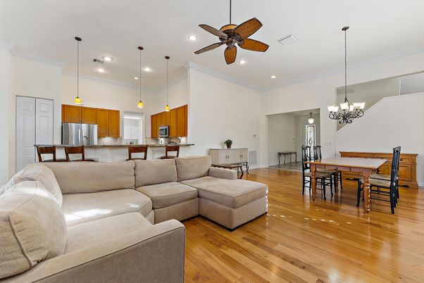 Chandelier, Dining room, Interior, Kitchen, Living room, Pendant Lights, Recessed Lighting, Stainless Steel Appliances, Wood Texture Flooring