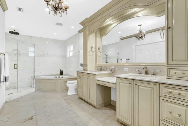Bathroom, Chandelier, Dual Sink Vanities, Glass Shower, Interior, Marble Walls, Recessed Lighting