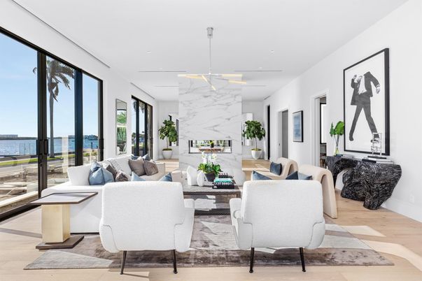 Fireplace, Interior, Living room, Marble Walls, Pendant Lights, Recessed Lighting, Water, Wood Texture Flooring