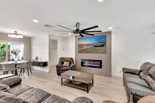 Dining room, Fireplace, Interior, Living room, Recessed Lighting, Wood Texture Flooring
