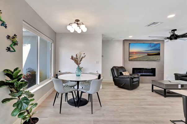 Dining room, Fireplace, Interior, Living room, Recessed Lighting, Wood Texture Flooring