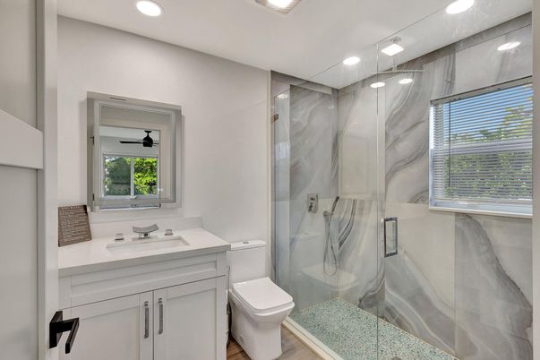 Bathroom, Glass Shower, Interior, Marble Walls, Recessed Lighting, Wood Texture Flooring