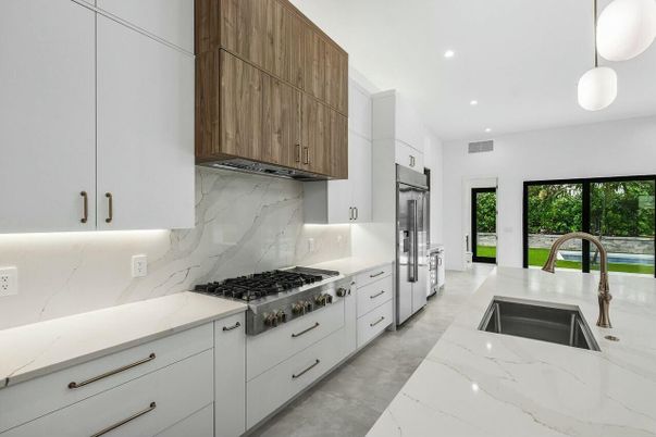 Interior, Kitchen, Marble, Marble Walls, Pendant Lights, Recessed Lighting, Stainless Steel Appliances