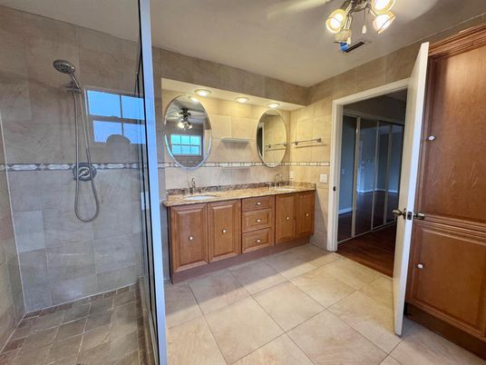 Bathroom, Dual Sink Vanities, Glass Shower, Interior, Wood Texture Flooring