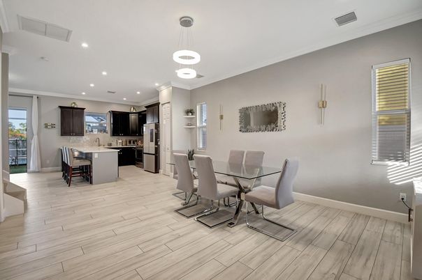 Dining room, Interior, Kitchen, Pendant Lights, Recessed Lighting, Stainless Steel Appliances, Wood Texture Flooring