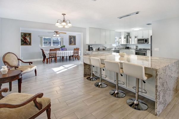 Chandelier, Dining room, Interior, Kitchen, Pendant Lights, Stainless Steel Appliances, Wood Texture Flooring