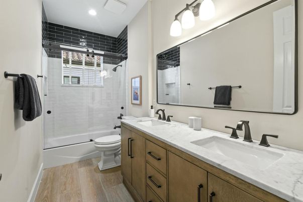 Bathroom, Dual Sink Vanities, Glass Shower, Interior, Recessed Lighting, Wood Texture Flooring