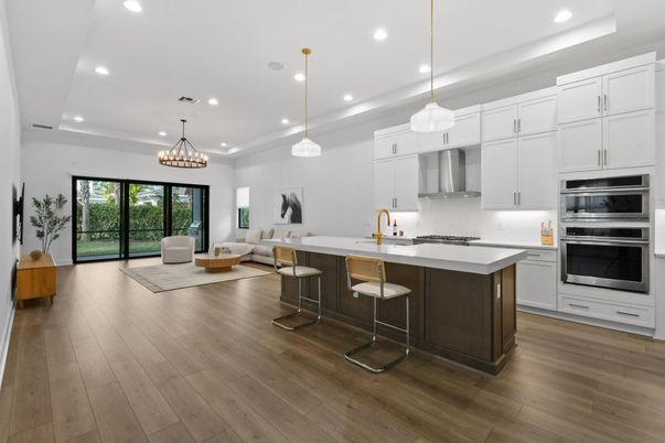 Chandelier, Interior, Kitchen, Living room, Pendant Lights, Recessed Lighting, Stainless Steel Appliances, Wood Texture Flooring
