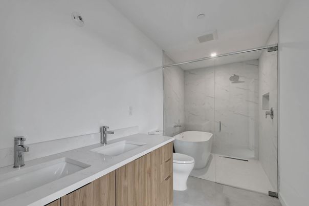 Bathroom, Dual Sink Vanities, Free Standing Baths, Glass Shower, Interior, Marble Walls, Recessed Lighting