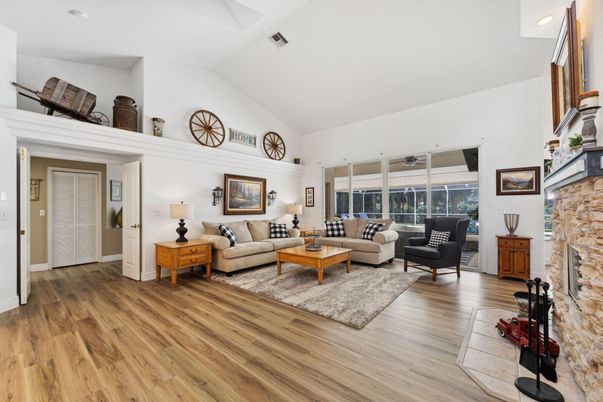 Fireplace, Interior, Living room, Recessed Lighting, Stone Walls, Wood Texture Flooring