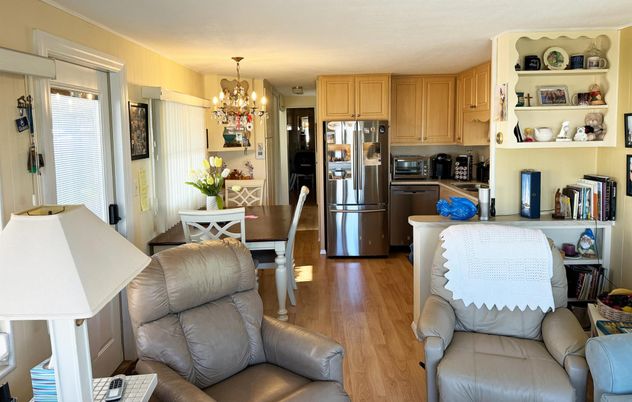 Chandelier, Dining room, Interior, Kitchen, Living room, Stainless Steel Appliances, Wood Texture Flooring