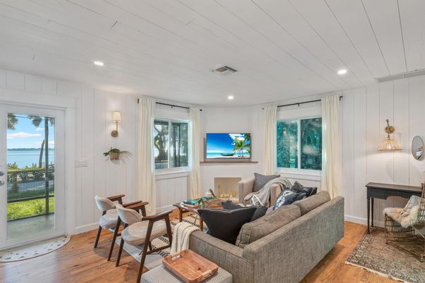 Fireplace, Interior, Living room, Pendant Lights, Recessed Lighting, Water, Wood Texture Flooring