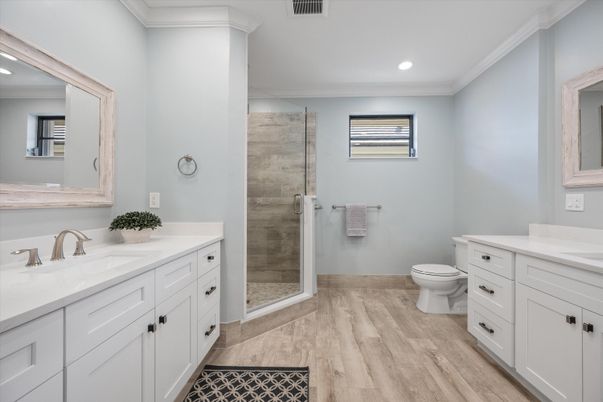 Bathroom, Dual Sink Vanities, Glass Shower, Interior, Recessed Lighting, Wood Texture Flooring