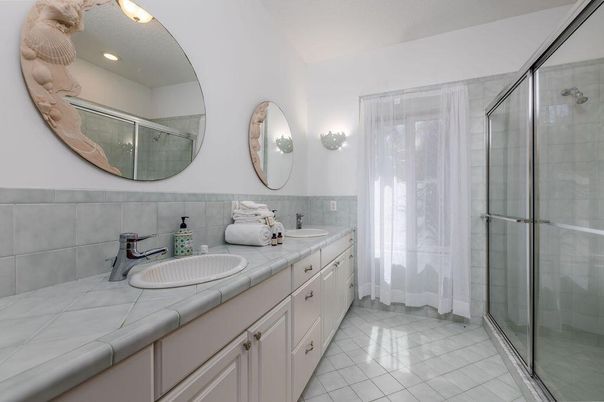 Bathroom, Dual Sink Vanities, Glass Shower, Interior, Recessed Lighting, Tile Countertops