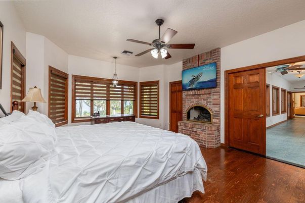 Bedroom, Fireplace, Interior, Pendant Lights, Stone Walls, Wood Texture Flooring
