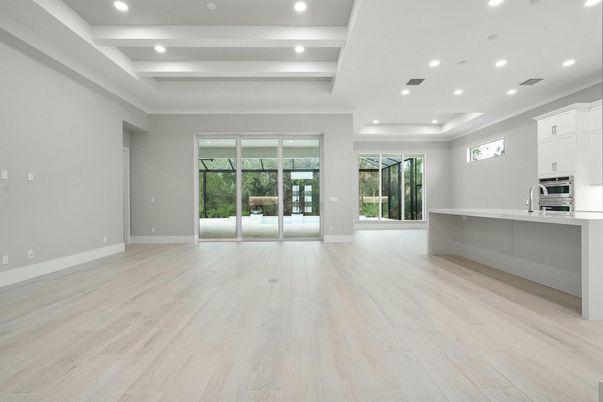 Empty room, Interior, Kitchen, Recessed Lighting, Stainless Steel Appliances, Wood Texture Flooring