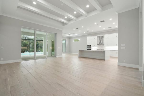 Empty room, Interior, Kitchen, Recessed Lighting, Stainless Steel Appliances, Wood Texture Flooring
