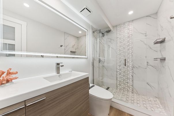 Bathroom, Glass Shower, Interior, Marble Walls, Recessed Lighting, Wood Texture Flooring