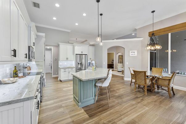 Dining room, Interior, Kitchen, Pendant Lights, Recessed Lighting, Stainless Steel Appliances, Wood Texture Flooring