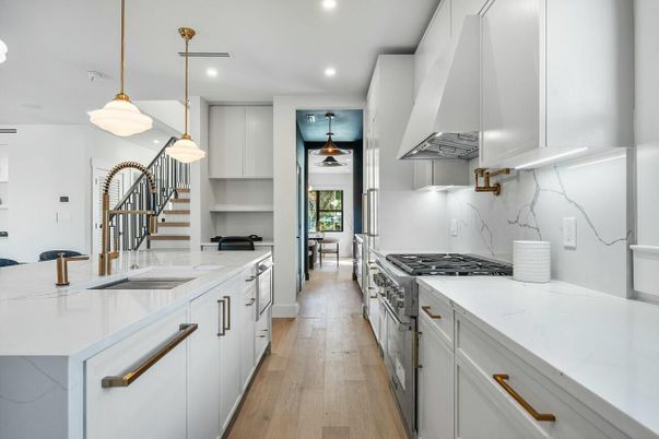 Interior, Kitchen, Marble Walls, Pendant Lights, Recessed Lighting, Stainless Steel Appliances, Wood Texture Flooring